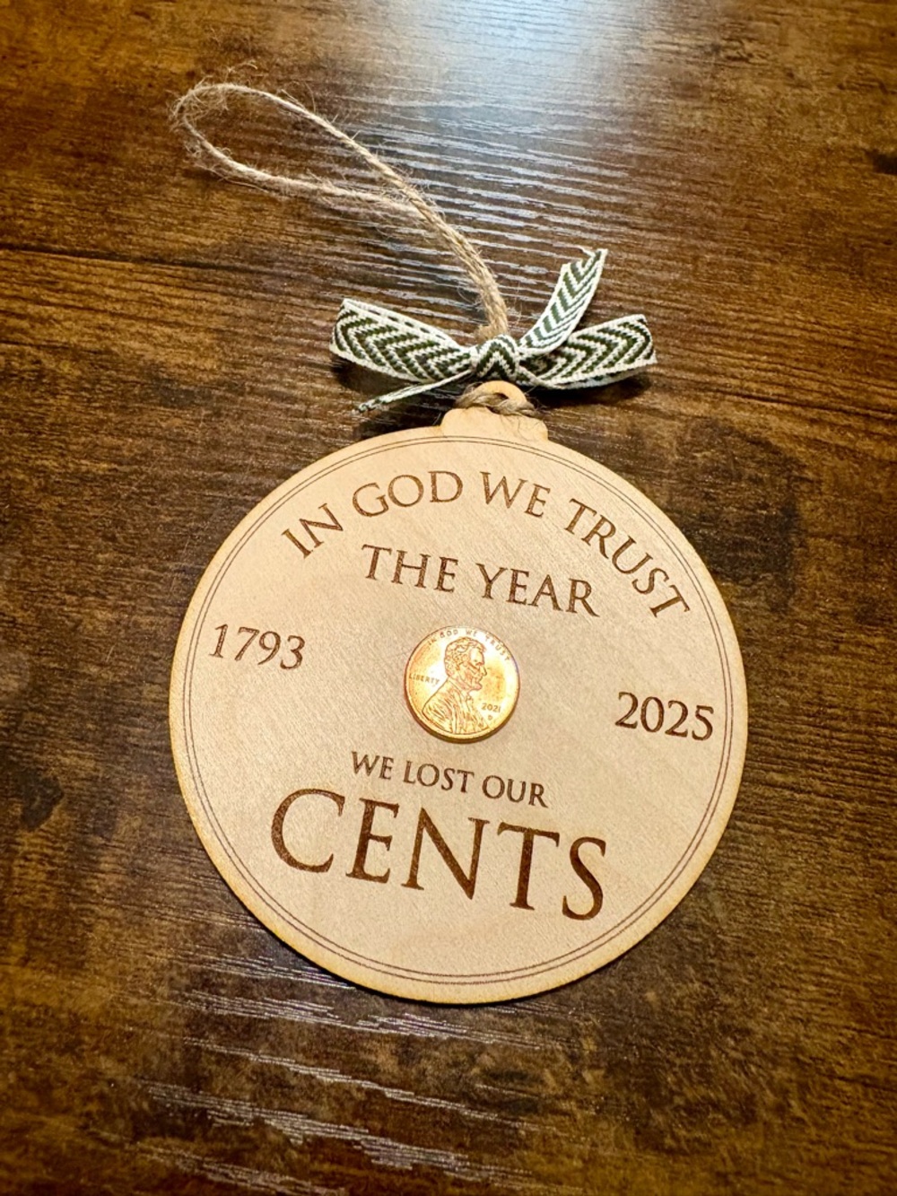 Natural Wood 'We Lost Our Cents' Holiday Ornament with Twine Hanger